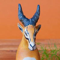 Painted Wood Sitting Antelope Sculpture