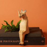 Painted Wood Rhino Sitting Sculpture