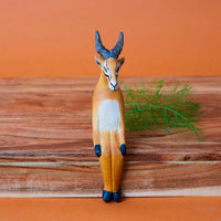 Painted Wood Sitting Antelope Sculpture