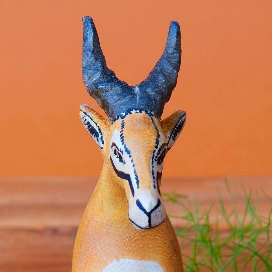 Painted Wood Sitting Antelope Sculpture